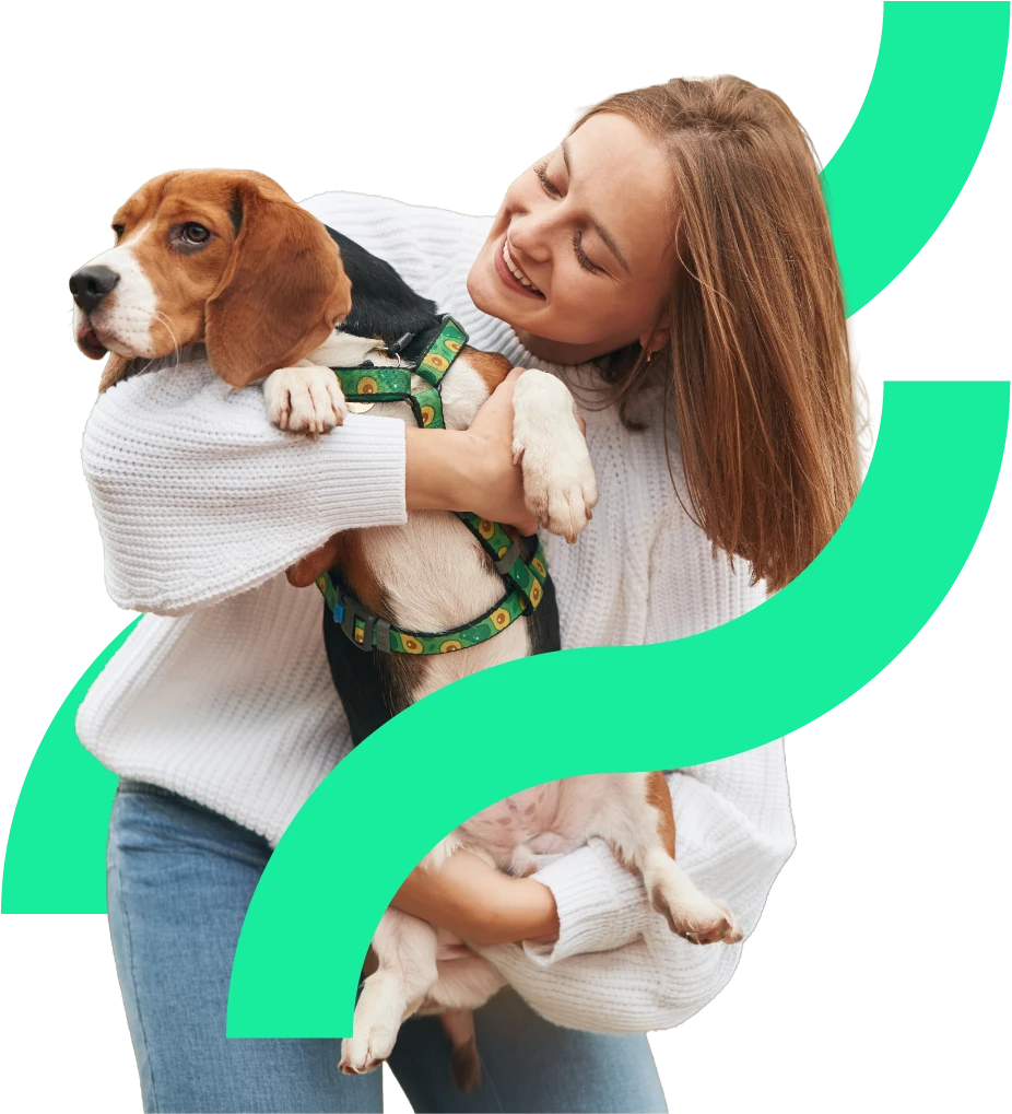 A woman hugging her beagle